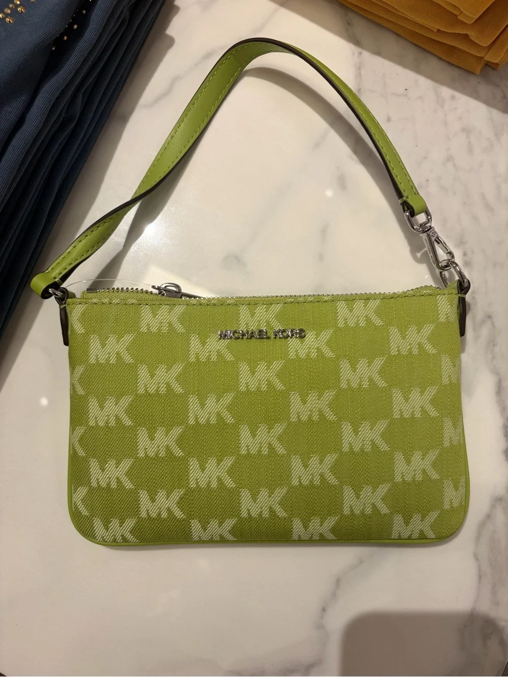 Michael Kors Signature Wristlet Clutch signature logo pink / brown/green